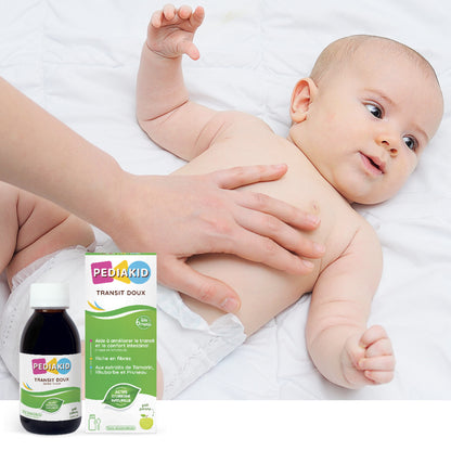 PEDIAKID Transit Doux sirop 125 ml - bebeluș căruia i se masează blând burtica, alături de flaconul și cutia produsului